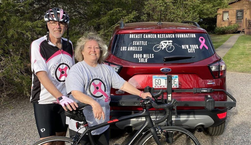 Al and Terry pose with their car and Al's bike before their 2020 ride