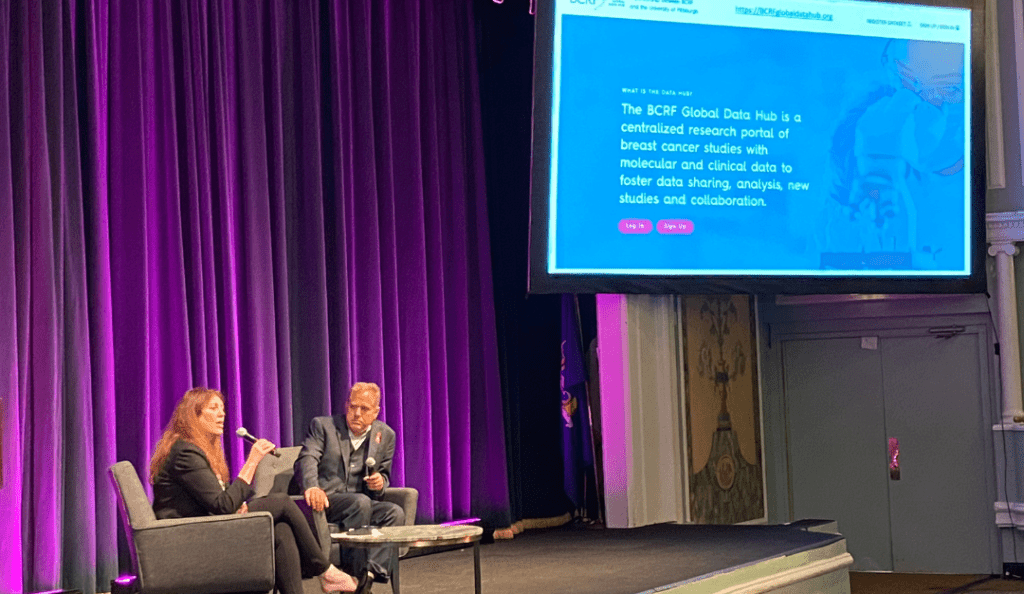 bcrf chief scientific officer dr. dorraya el-ashry speaks about the global data hub on a stage with a purple curtain