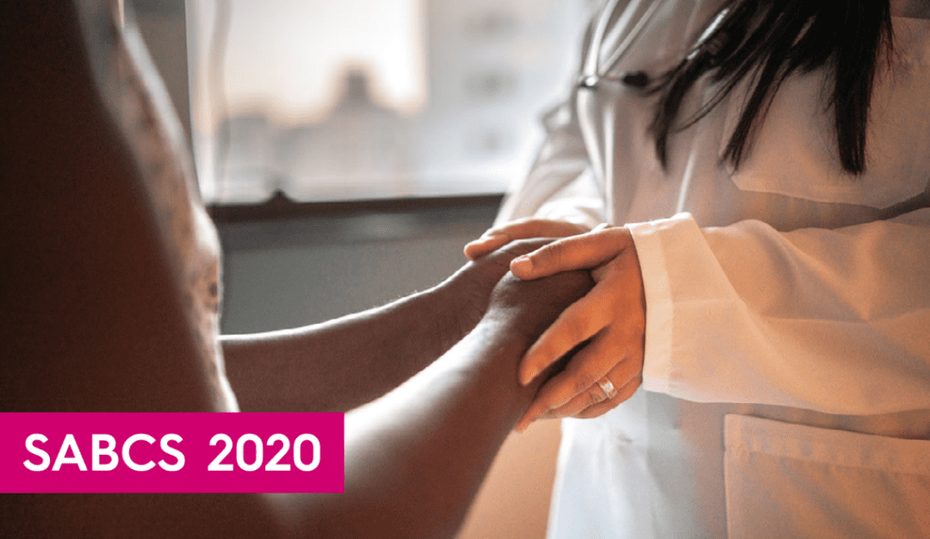 patient and doctor holding hands