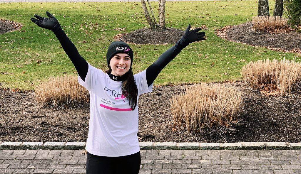 Photo of Erica Harriton wearing a BCRF t-shirt during a run|Erica Harriton having a post-race bagel