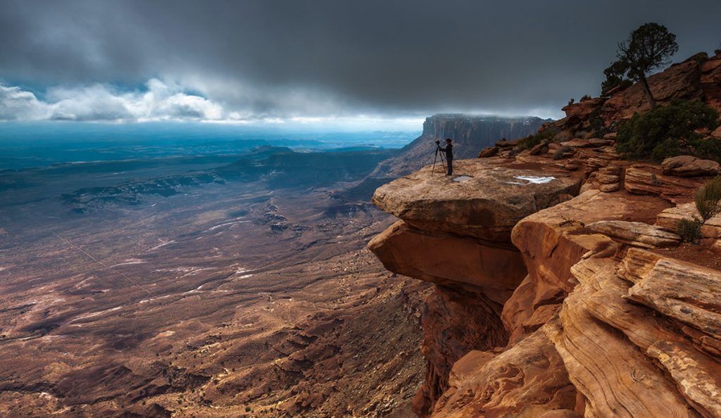 Photographer Jennifer King takes photos in a canyon|Headshot photo of photographer and BCRF fundraiser Jennifer King