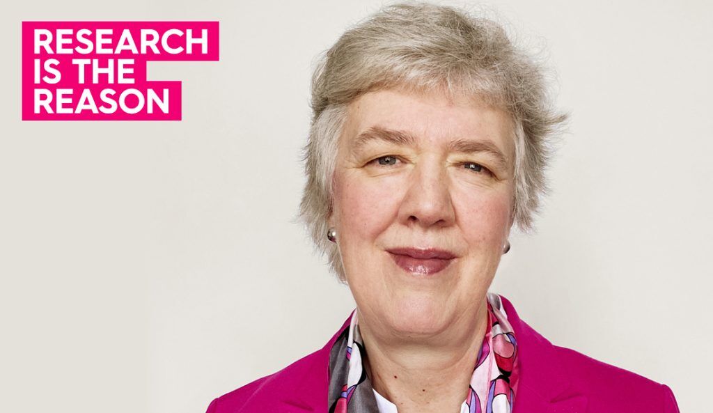 a portrait of bcrf researcher dr. wendie berg wearing a pink blazer and smiling at camera