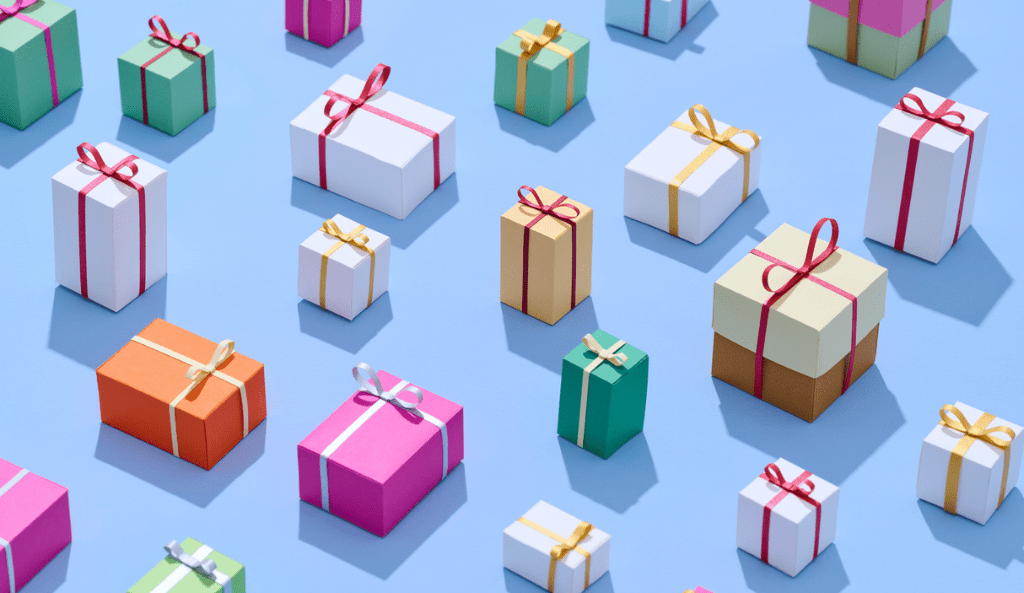 Colorful Gift Boxes Arranged on a Blue Background in Various Sizes