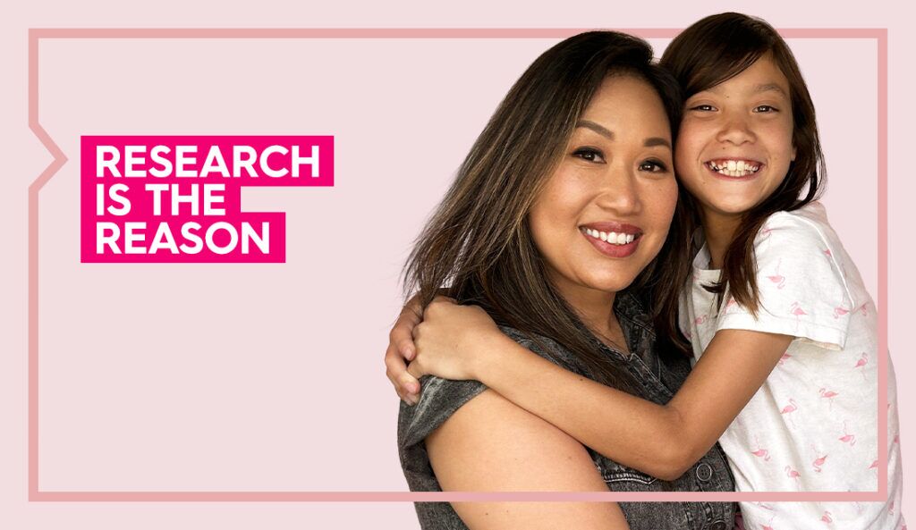 a portrait of kannie and her daughter against a pink background