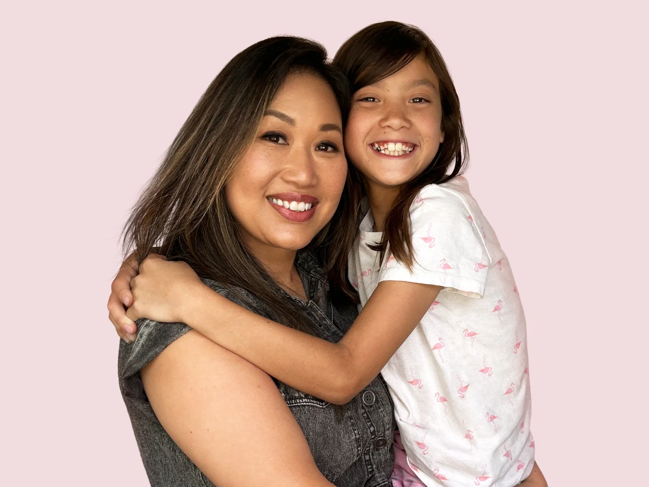 A woman embracing her daughter.