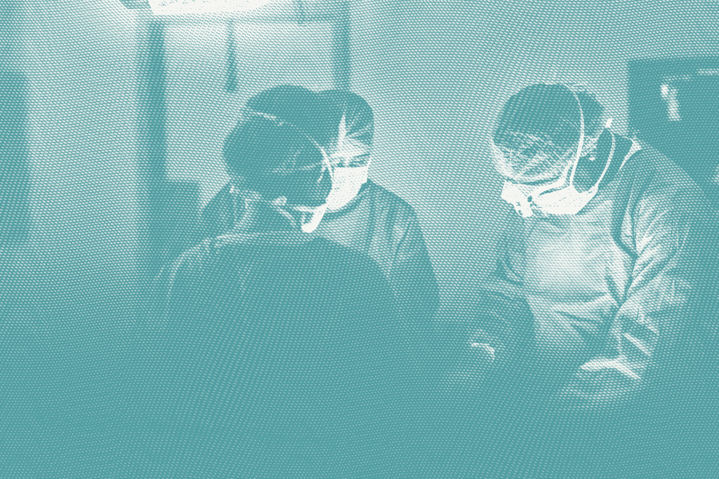 Several surgeons around a patient; illustrative of breast cancer surgery