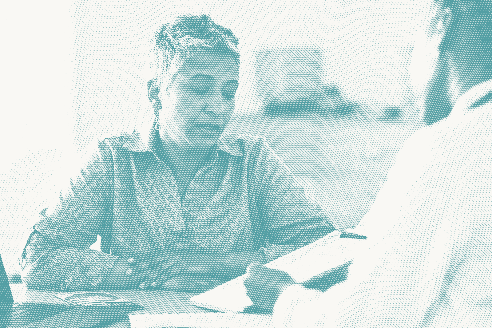 a woman speaks with her doctor; illustrative of a conversation about breast cancer recurrence