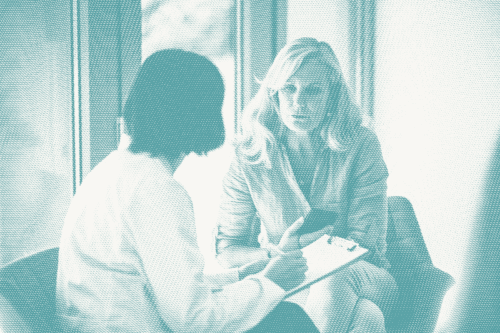 a woman consults with a doctor about targeted therapy for breast cancer