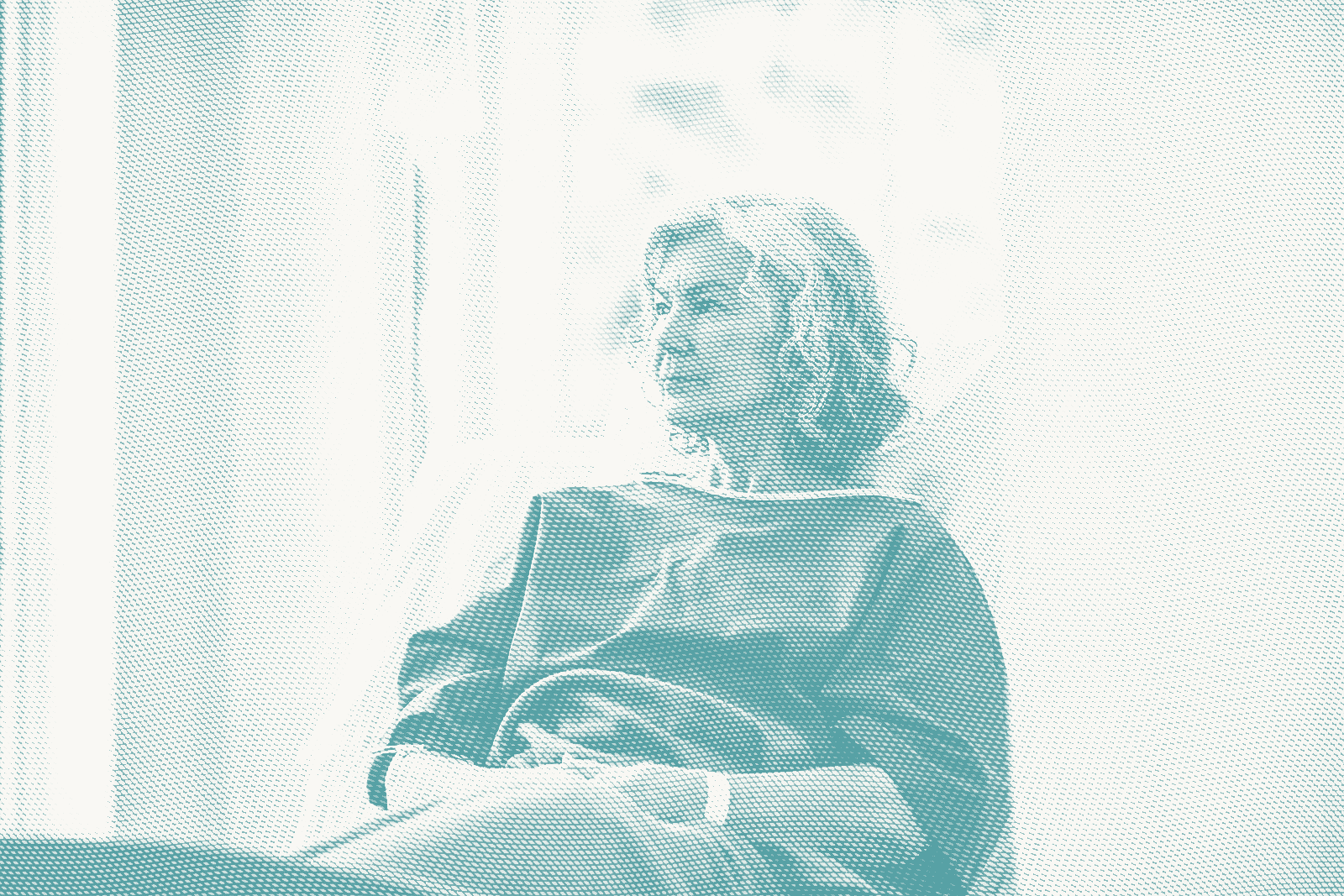 an older woman wearing a hospital gown waits for a lumpectomy