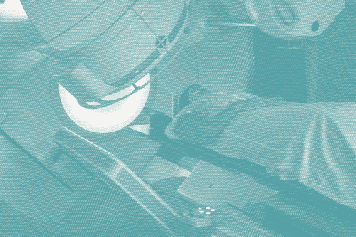 a woman gets radiation for breast cancer; she lies down with the machine overhead