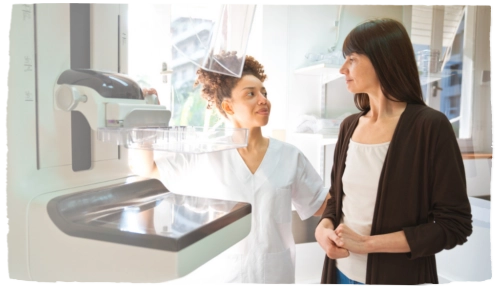 A woman speaking with a nurse.