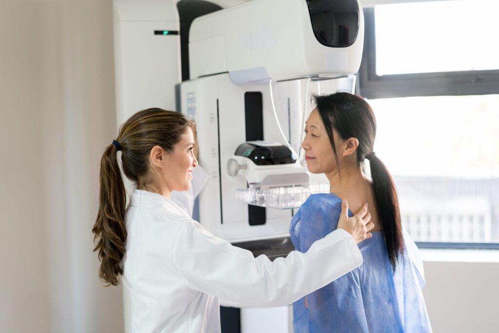 Young Asian woman getting a mammogram