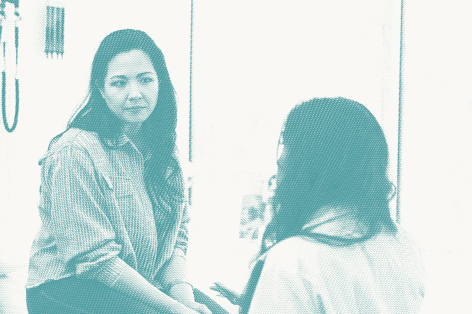 A woman talking to her doctor. She has a concerned expression