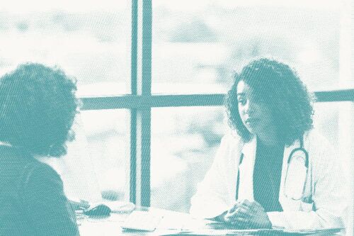 a doctor speaks to her patient